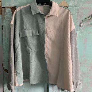 Two colored green and cream button up jacket